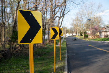 yellow chevron road sign