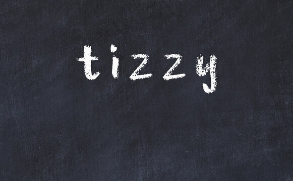 College chalk desk with the word tizzy written on in