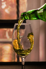 wine bottle filling glass goblet for drinking