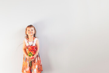 Little girl with bouquet of flowers.