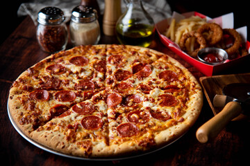 pepperoni pizza with french fries and onion rings