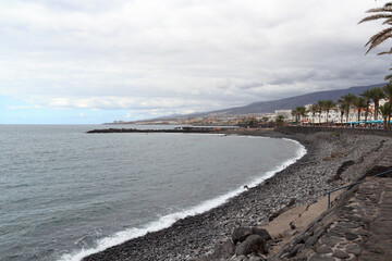 Beach and Atlantic Ocean panorama in holiday resort Playa de las Americas on Canary Island Tenerife, Spain