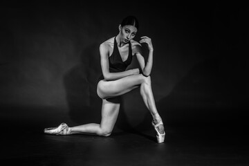 Fototapeta na wymiar black and white vintage dramatic portrait of a dancing girl-ballerina