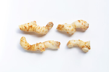 Fresh galangal isolated on white.