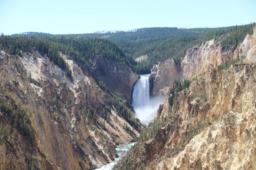 Waterfalls surrounded with yellowstone in the Yellowstone National Park.