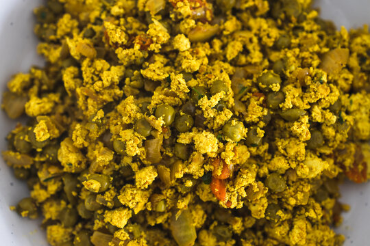 plant-based food, vegan scrambled tofu and peas with Indian spices