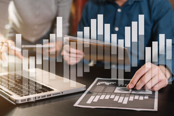 Business team present. professional investor working new start up project. Finance managers meeting.using smart phone and laptop and digital tablet computer in modern office. 