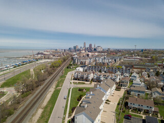 Fototapeta premium Cleveland industrial railroad past and lakefront future aerial view of the city