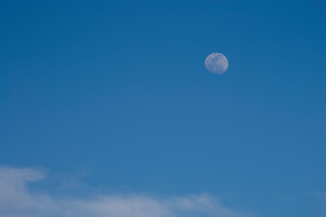 Naklejka na ściany i meble moon over blue sky