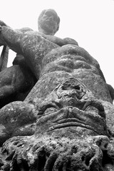 sixteenth century era volcanic rock statues of Hercules fighting with a monster, in the village of Bomarzo close to Rome 