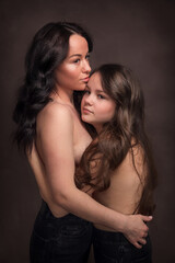 Loving mother and daughter embrace. Family portrait.