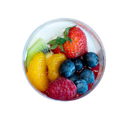 Yoghurt garnished with fruit, strawberrie, blueberries, raspberries, oranges and kiwi. Top view.