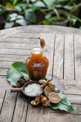 Herbal drinks of beras kencur are packed in glass bottles,raw materials of white rice,rhizomes of kencur,brown sugar and tamarind