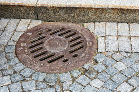 Sewer manhole on a city road.