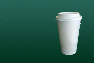 White coffee cup with green star background