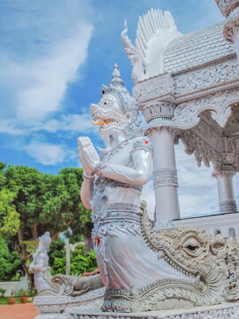 view of white Karuda Sculpture (Phraya Krut in Thai) with blue sky background, Lak Muang City Pillar Nan, northern of Thailand.
