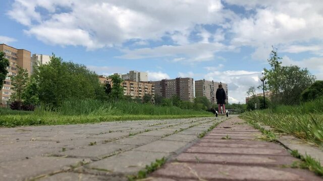 The young girl expertly rides a gyroscooter the alley open parkland