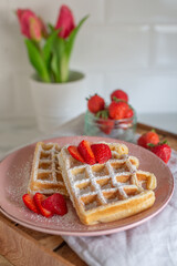 Sweet crispy waffles with strawberries 