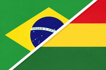 Fototapeta premium Brazil and Bolivia, symbol of two national flags from textile. Championship between two American countries.