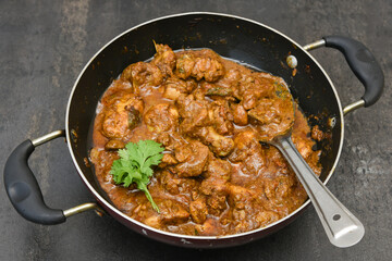 Chettinad chicken curry is a hot and spicy dish Tamil Nadu, South India. Gravy prepared from roast and ground Indian spices,coconut or garam masala for meat / non-vegetarian recipe/ cuisine.