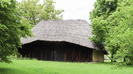 Fototapeta premium The old house of peasants in the museum Pirogovo or Pirogov. Country estate. National Museum of Folk Architecture and Everyday Life of Traditional Folklore Houses of Different Regions of Ukraine