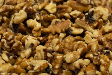 Peeled walnut over a white background top view