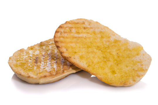 Toasted mollete with olive oil, typical Andalusian breakfast isolated on white background.