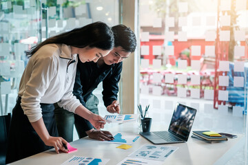 Young asian modern people in smart casual wear having meeting planning work together as a team and present ideas at work.