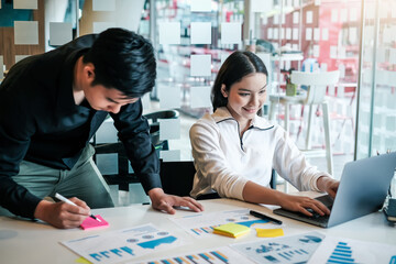 Young asian modern people in smart casual wear having meeting planning work together as a team and present ideas at work.