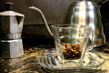 manual tools for processing a cup of coffee, ranging from coffee cups, mocha pots to make espresso, kettle with goose neck to pour water stably, manual coffee grinder with various sizes of powder.