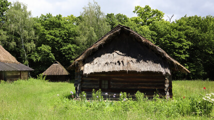 Fototapeta na wymiar Ukraine, Kiev - June 11, 2020. The old house of peasants in the museum Pirogovo. National Museum of Folk Architecture and Everyday Life of Traditional Folklore Houses of Different Regions of Ukraine
