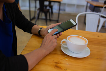 concept businesswoman hands searching for data on Notebook with analyzing charts at his workplace.