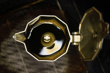 the process of extracting coffee into espresso using mocha pots, boiling water at the bottom...