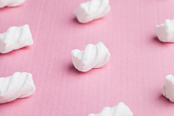 Marshmallows on a pink background
Soft pink color mini marshmallows dessert top view, flat lay style.
