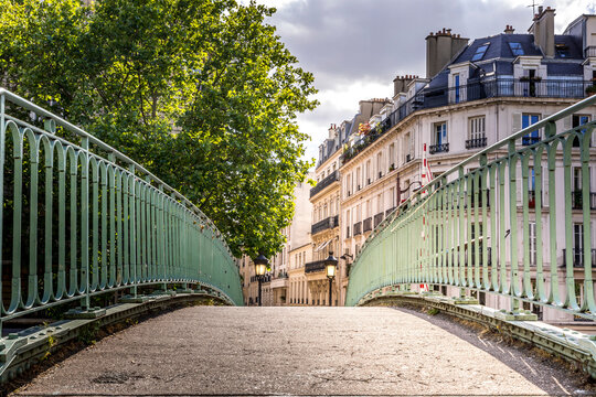 Paris, France - May 25, 2020: Iconic bridge of the Canal Saint-Martin in Paris France, a popular destination for Parisians, tourists and students on a beautiful Spring day