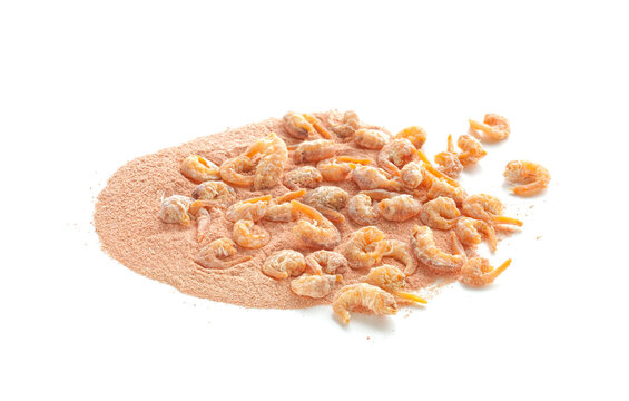 Closeup of dried shrimps and ground shrimps isolated on white background