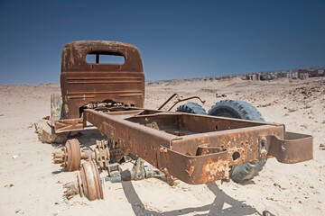Fototapeta na wymiar Remains of an old abandoned truck in the desert