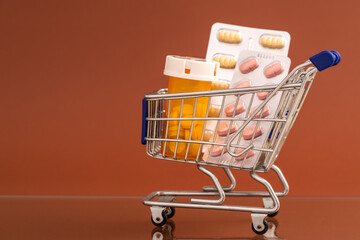 Toy shopping basket with medical pills,