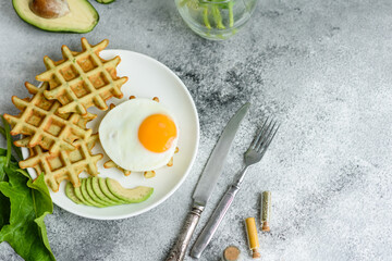 Fresh delicious and nutritious breakfast with waffles with spinach