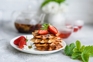 Delicious fresh baked belgian waffles with berries and fruit