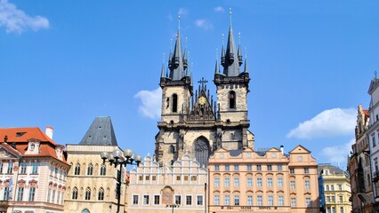 Fototapeta premium Prague town Europe Czech republic gothic architecture cityscape old walls antique watches blue sky background 