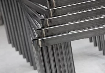 Fotobehang Office Furniture Industry. Metal parts of tables.  Steel frames © A