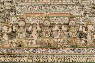 Angel statues carrying the base of Mondop, Wat Arun, Bangkok, Thailand.