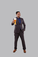 Businessman Showing Beer Glass. Indian Business man Standing Full Length with Beer in Hand