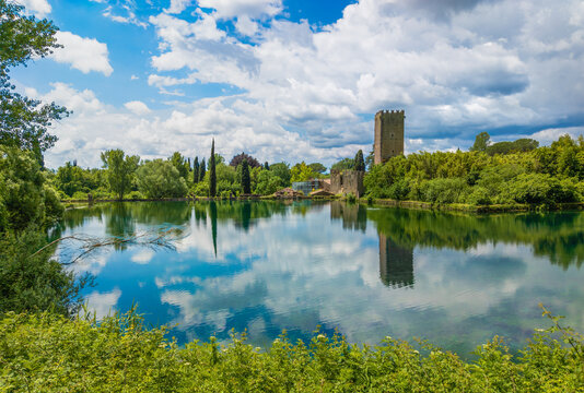 Garden of Ninfa, (Lazio, Italy) - A natural monument with medieval ruins in stone, flowers park and an awesome torrent with little fall. Province of Latina, central Italy. Here the little lake.