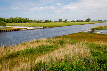 The top of a modern aqueduct, the canal crosses the road where traffic travels. Picture taken in the province of Friesland, region Gaasterland
