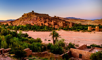 Fototapeta na wymiar Dusk at Aït Benhaddou. It is a fortified village along the former caravan route between the Sahara and Marrakech in present-day Morocco. It has been a UNESCO World Heritage Site since 1987.