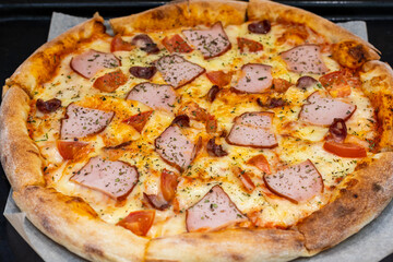 pizza with home delivery, eat at the table against the background of food