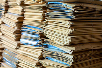 Stack Documents in brown envelopes in office.