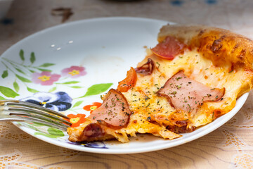pizza with home delivery, eat at the table against the background of food